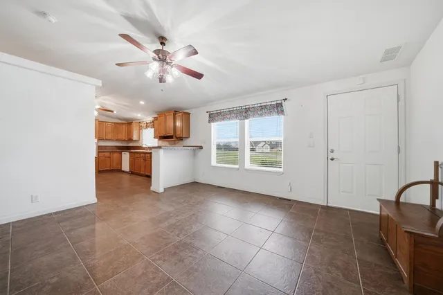 a view of a kitchen with a sink and a window