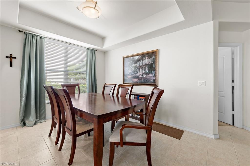1953 Crestview Way, Unit 161 Naples, FL 34119 - Photo 13 of 37 a view of a dining room that has a table and chairs