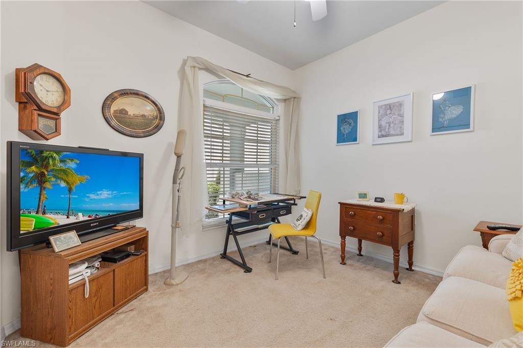 1953 Crestview Way, Unit 161 Naples, FL 34119 - Photo 19 of 37 a living room with furniture and a flat screen tv