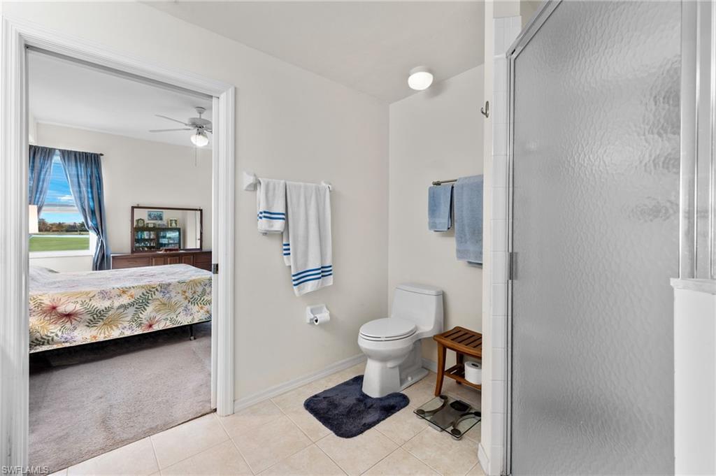1953 Crestview Way, Unit 161 Naples, FL 34119 - Photo 21 of 37 a bathroom with a sink toilet and shower
