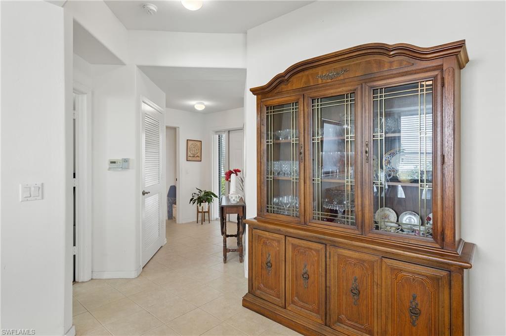 1953 Crestview Way, Unit 161 Naples, FL 34119 - Photo 22 of 37 a view of entryway with a hallway and wooden floor