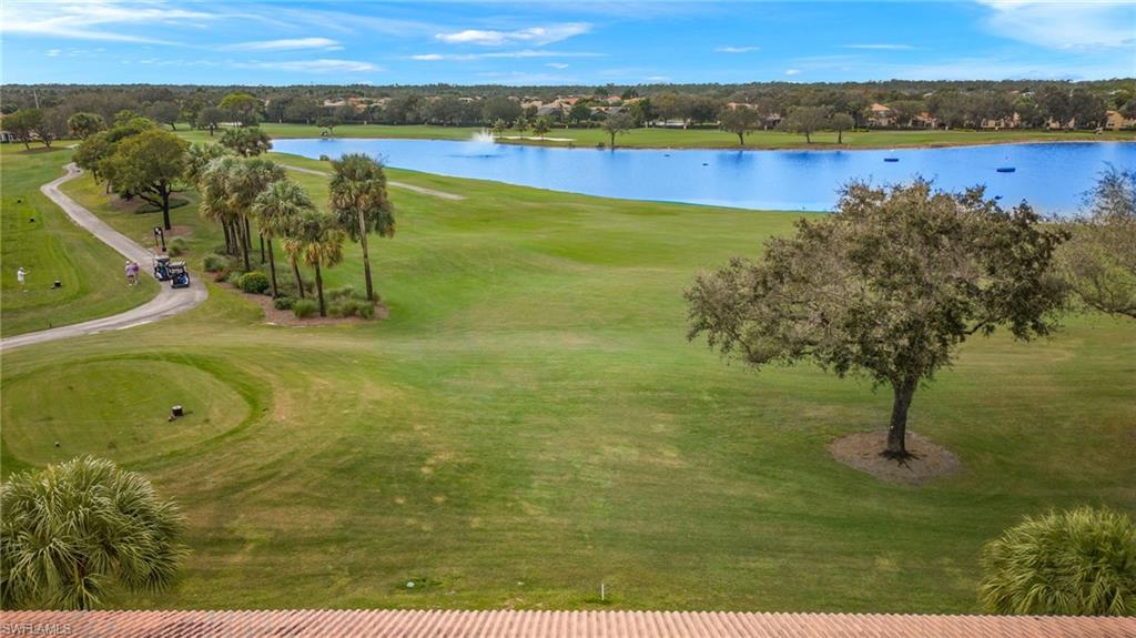 1953 Crestview Way, Unit 161 Naples, FL 34119 - Photo 26 of 37 a view of a lake with a mountain