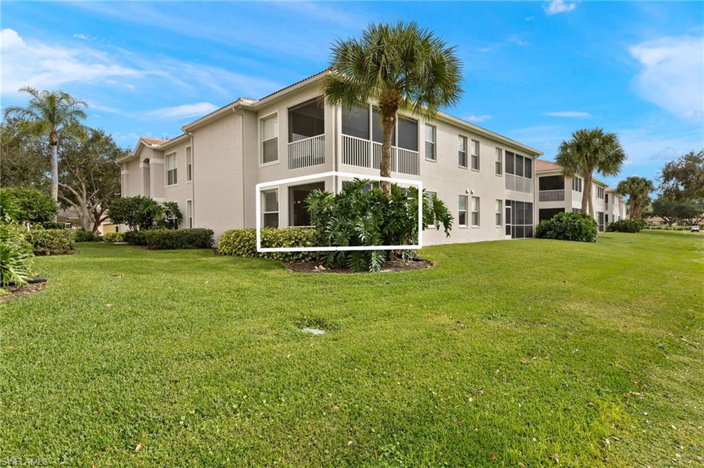 1953 Crestview Way, Unit 161 Naples, FL 34119 - Photo 29 of 37 a front view of a house with a yard
