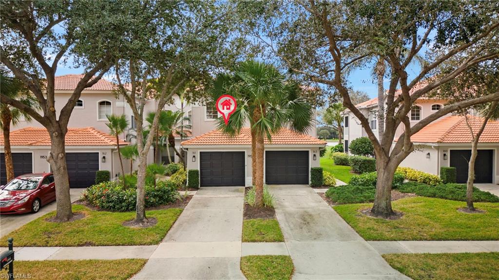 1953 Crestview Way, Unit 161 Naples, FL 34119 - Photo 34 of 37 a front view of a house with garden