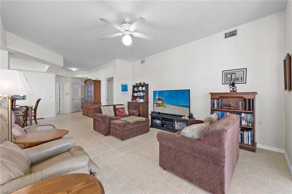1953 Crestview Way, Unit 161 Naples, FL 34119 - Photo 7 of 37 a living room with furniture and a flat screen tv