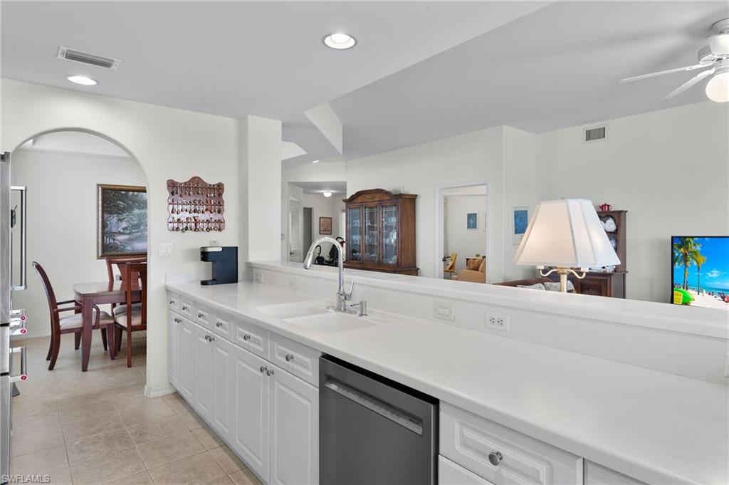 1953 Crestview Way, Unit 161 Naples, FL 34119 - Photo 10 of 37 a spacious bathroom with a sink a mirror and a bathtub