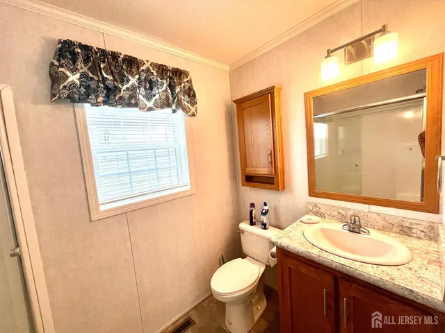 a bathroom with a glass shower door