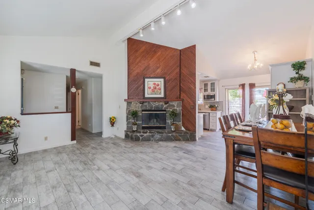 a view of a livingroom with furniture and a fireplace