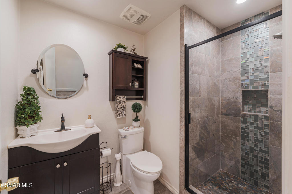 1917 Fitzgerald Road Simi Valley, CA 93065 - Photo 18 of 55 a bathroom with a sink toilet and shower