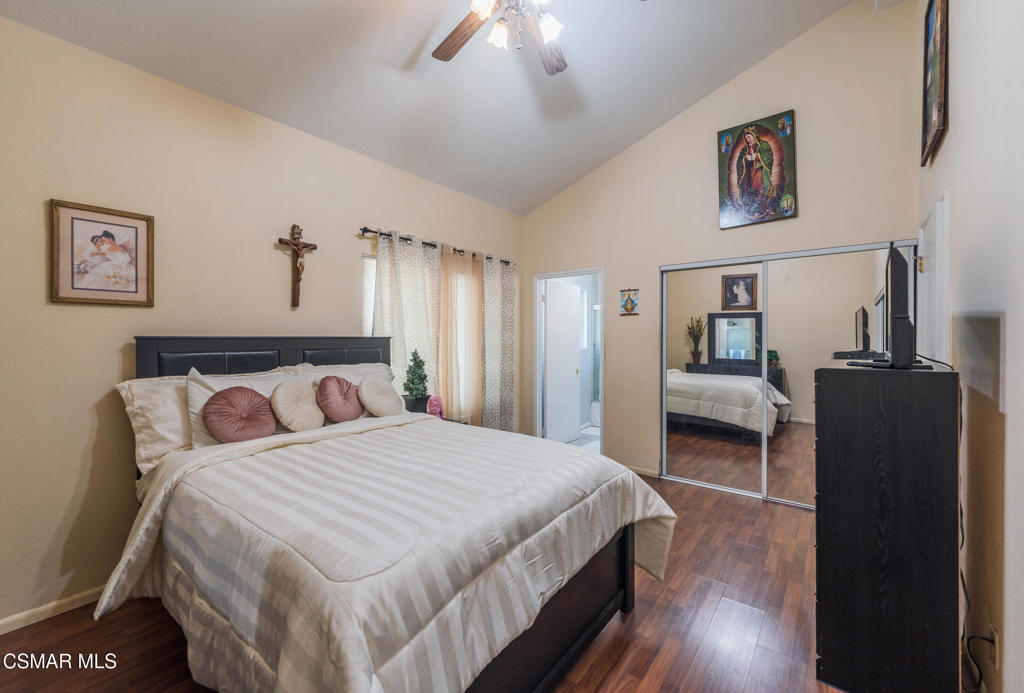 1917 Fitzgerald Road Simi Valley, CA 93065 - Photo 25 of 55 a bedroom with a bed and a chandelier