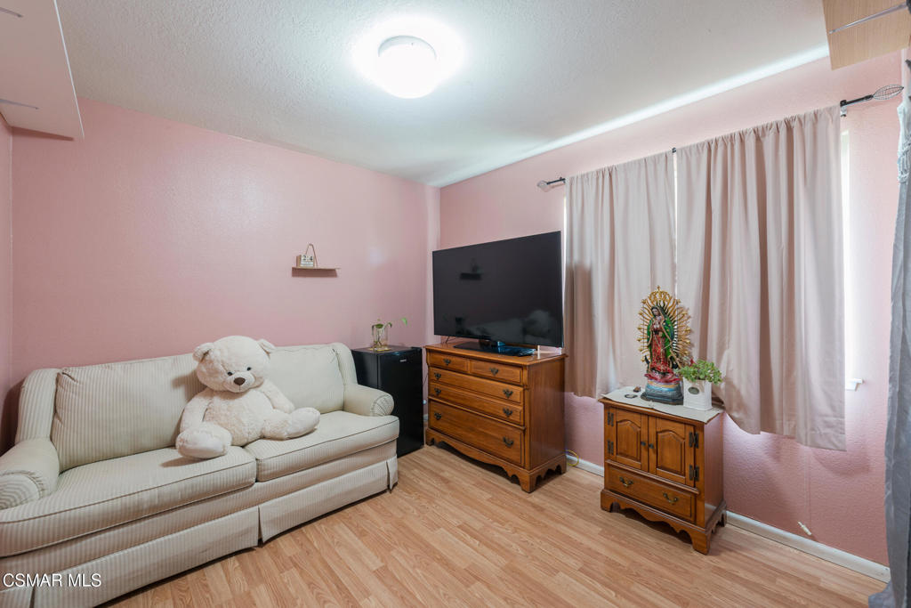 1917 Fitzgerald Road Simi Valley, CA 93065 - Photo 37 of 55 a living room with furniture and a flat screen tv