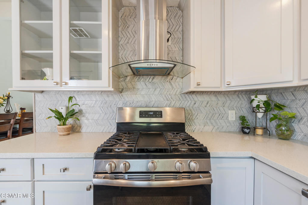 1917 Fitzgerald Road Simi Valley, CA 93065 - Photo 4 of 55 a stove top oven sitting inside of a kitchen