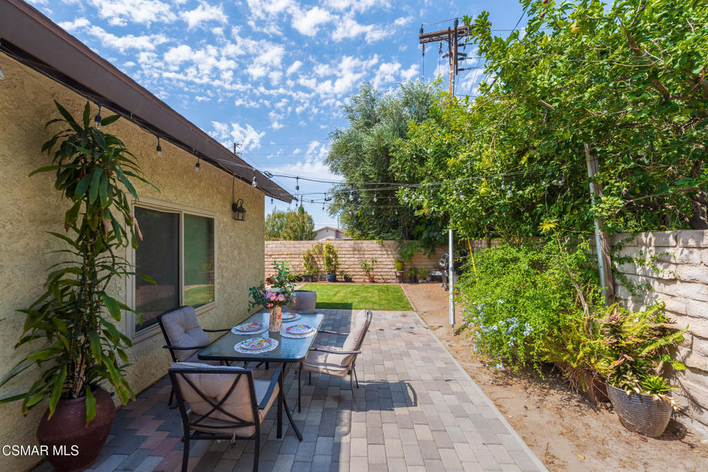 1917 Fitzgerald Road Simi Valley, CA 93065 - Photo 42 of 55 a view of backyard with table and chairs and potted plants