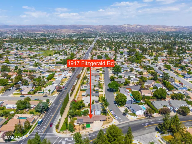 an aerial view of a house with a swimming pool