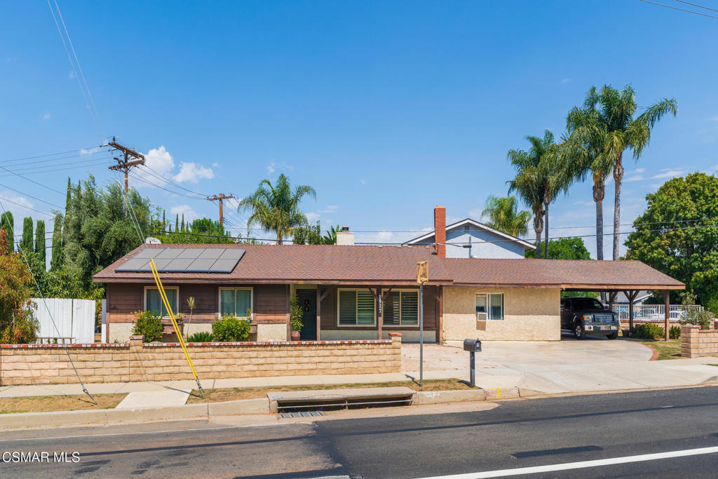 1917 Fitzgerald Road Simi Valley, CA 93065 - Photo 5 of 55 a front view of a house with a yard table and chairs