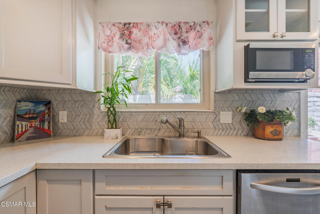 1917 Fitzgerald Road Simi Valley, CA 93065 - Photo 10 of 55 a kitchen with a sink and a potted plant