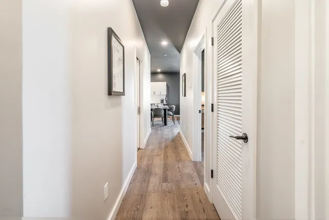 a bedroom with a bed and a lamp