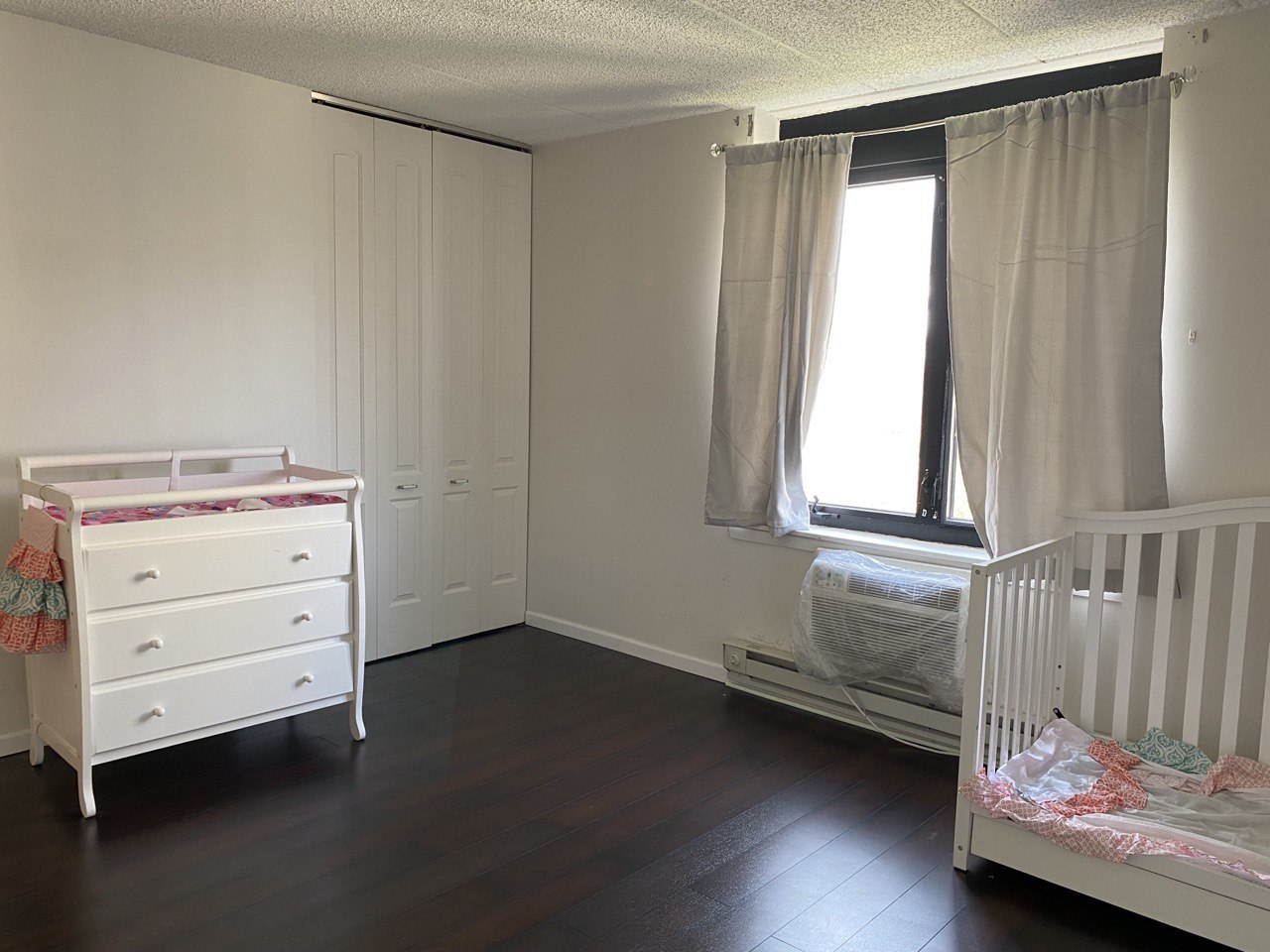 9128 West Terrace Drive, Unit 4B Niles, IL 60714 - Photo 11 of 24 a storage room with wooden floor and window