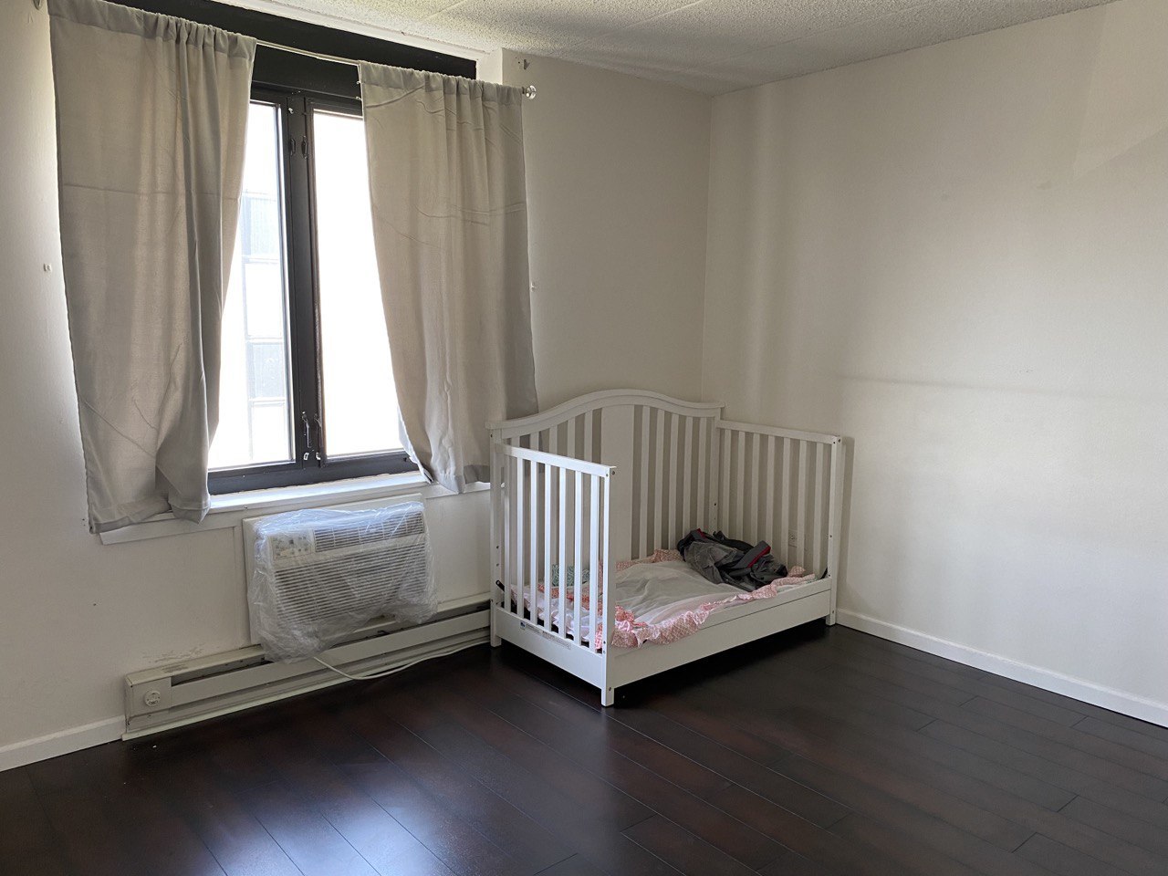 9128 West Terrace Drive, Unit 4B Niles, IL 60714 - Photo 12 of 24 a room with a window and wooden floor