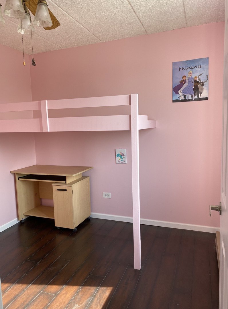 9128 West Terrace Drive, Unit 4B Niles, IL 60714 - Photo 15 of 24 a room with wooden floor and potted plant