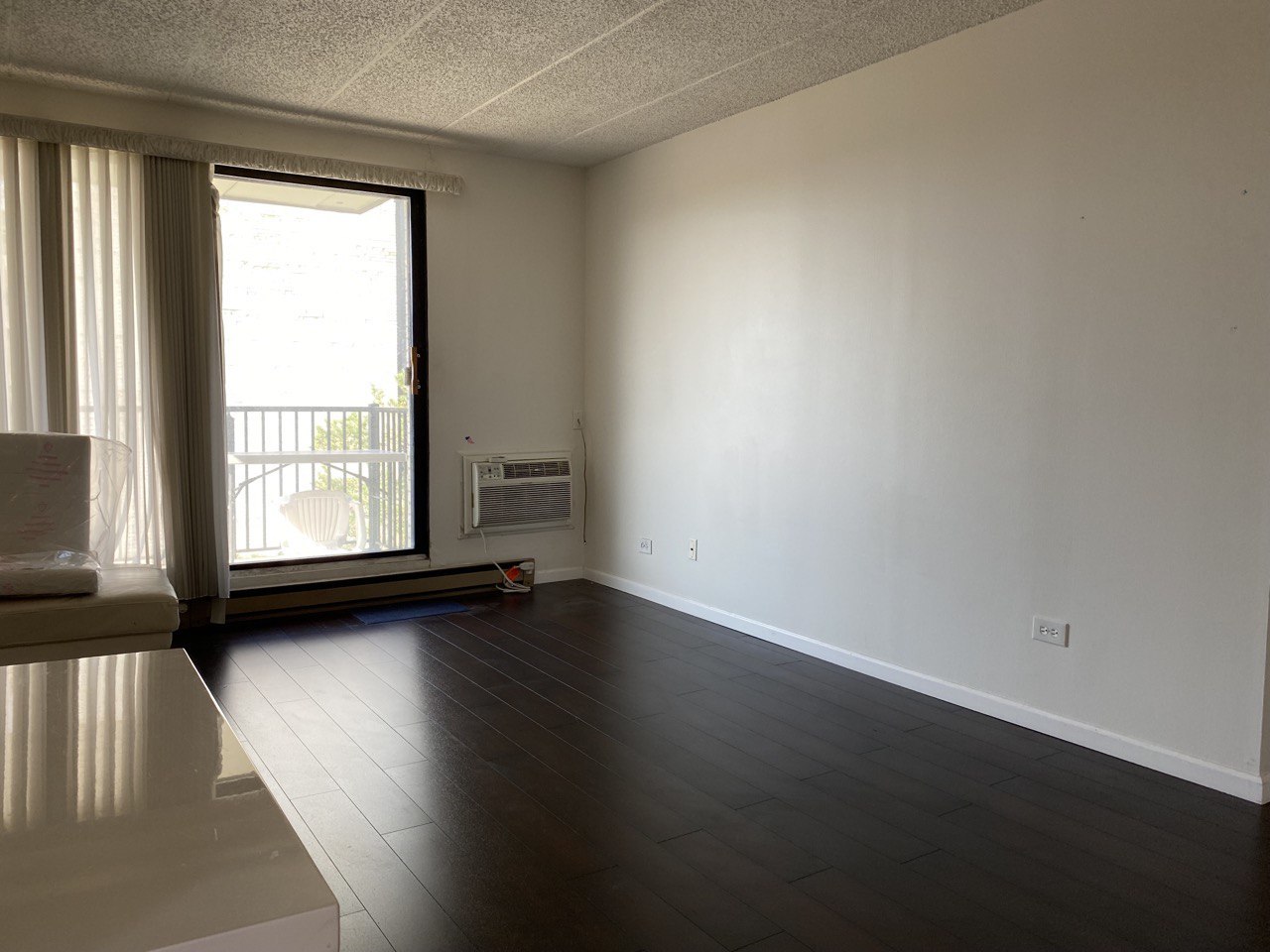 9128 West Terrace Drive, Unit 4B Niles, IL 60714 - Photo 5 of 24 an empty room with wooden floor and windows
