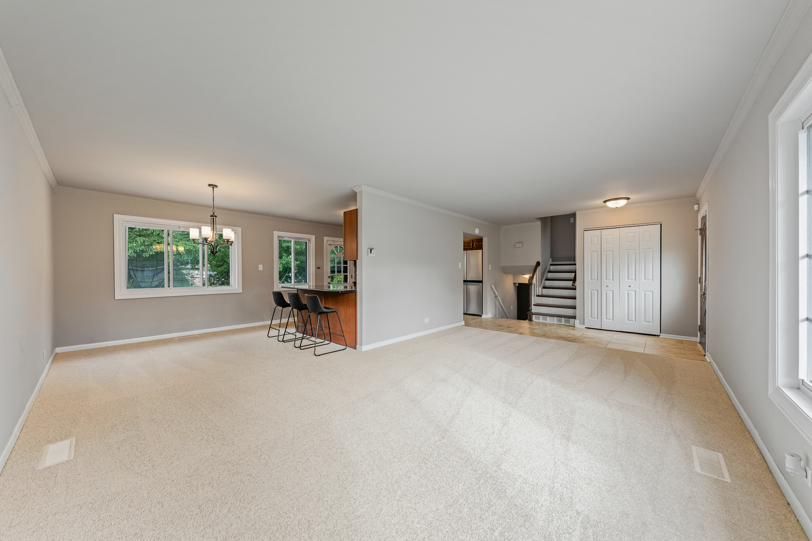 303 Springfield Street Park Forest, IL 60466 - Photo 4 of 16 an empty room with windows and cabinet