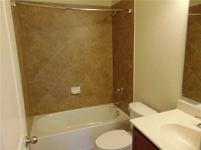 a bathroom with a sink and toilet