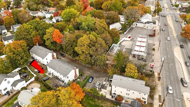 an aerial view of residential houses with outdoor space