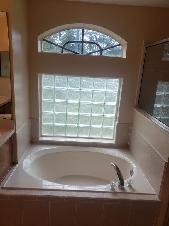 1 Westmar Place Palm Coast, FL 32164 - Photo 17 of 38 a view of roof with a bathtub