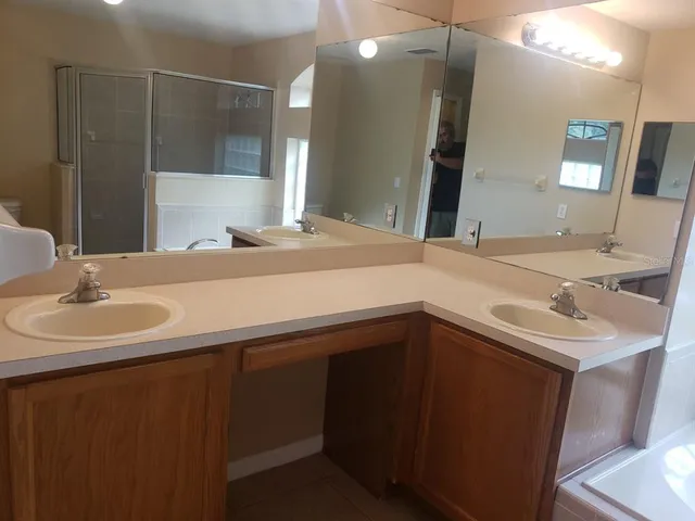 a bathroom with a sink and a mirror