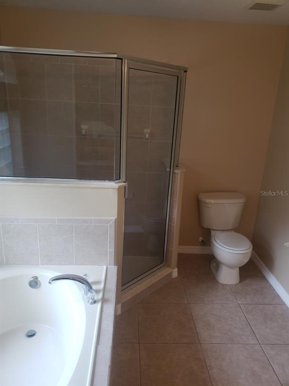 1 Westmar Place Palm Coast, FL 32164 - Photo 19 of 38 a bathroom with a sink and a toilet