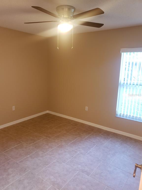 1 Westmar Place Palm Coast, FL 32164 - Photo 21 of 38 an empty room with a empty space and windows