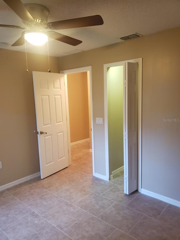 1 Westmar Place Palm Coast, FL 32164 - Photo 23 of 38 an empty room with closet and mirror