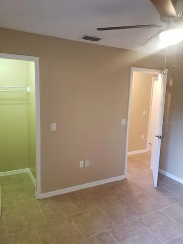 a view of an empty room with a window