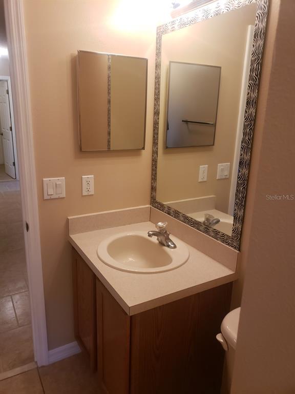 1 Westmar Place Palm Coast, FL 32164 - Photo 31 of 38 a bathroom with a sink and a mirror
