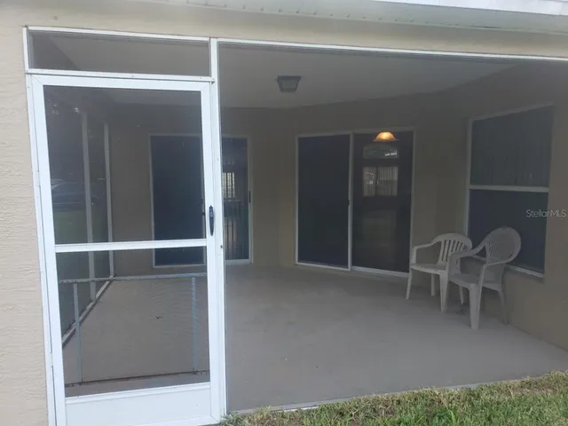 a view of a house with backyard and garden