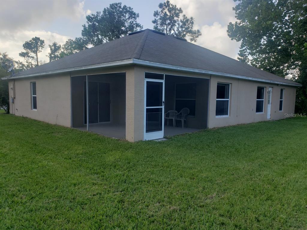 1 Westmar Place Palm Coast, FL 32164 - Photo 37 of 38 a view of a house with backyard and garden