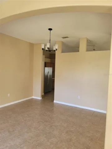 a view of empty room with a sink