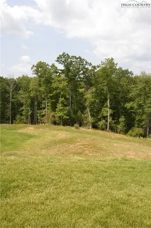 a view of a yard with an ocean