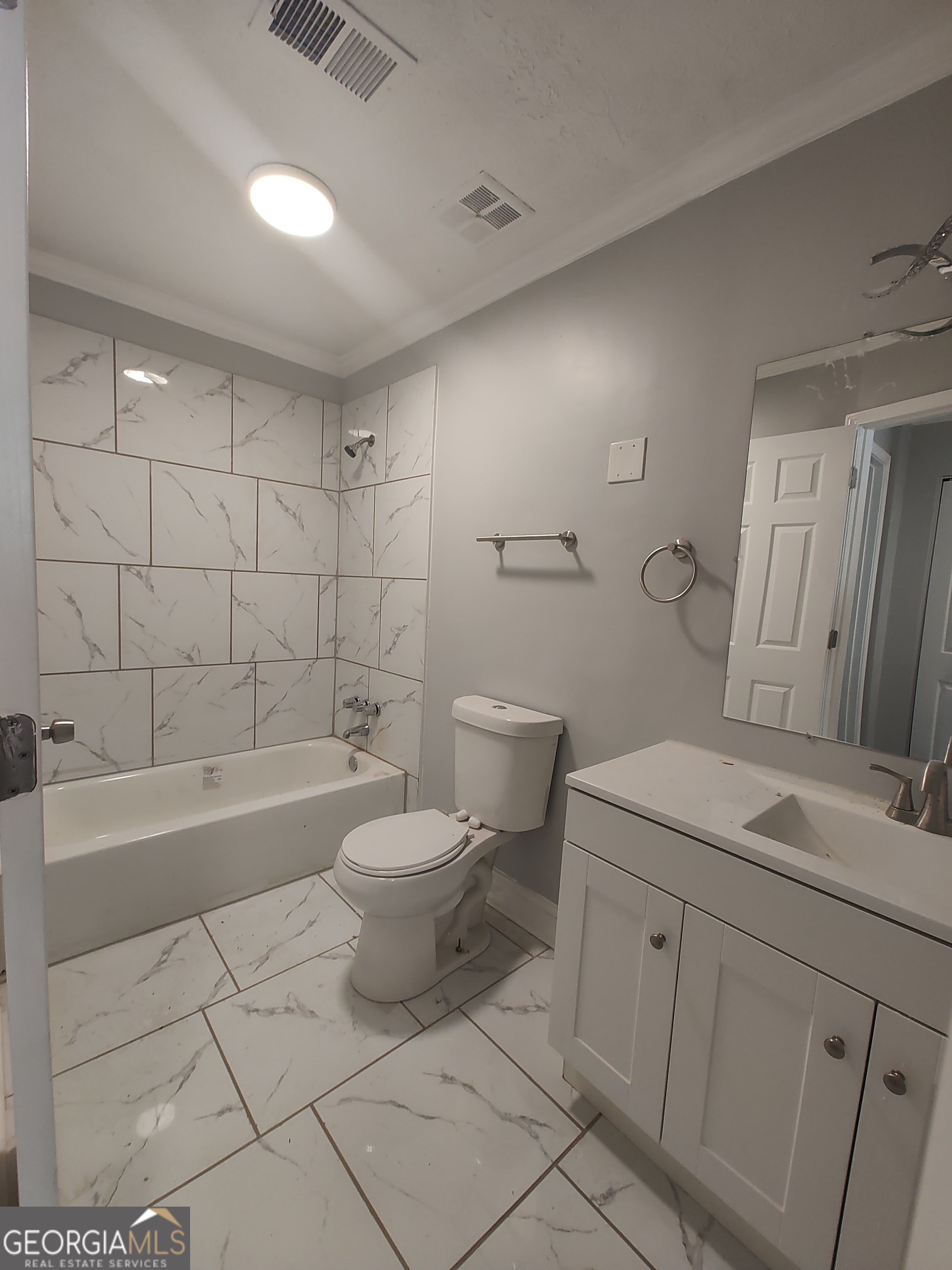 1625 Conley Road, Unit 275 Conley, GA 30288 - Photo 11 of 15 a bathroom with a sink a toilet and bathtub