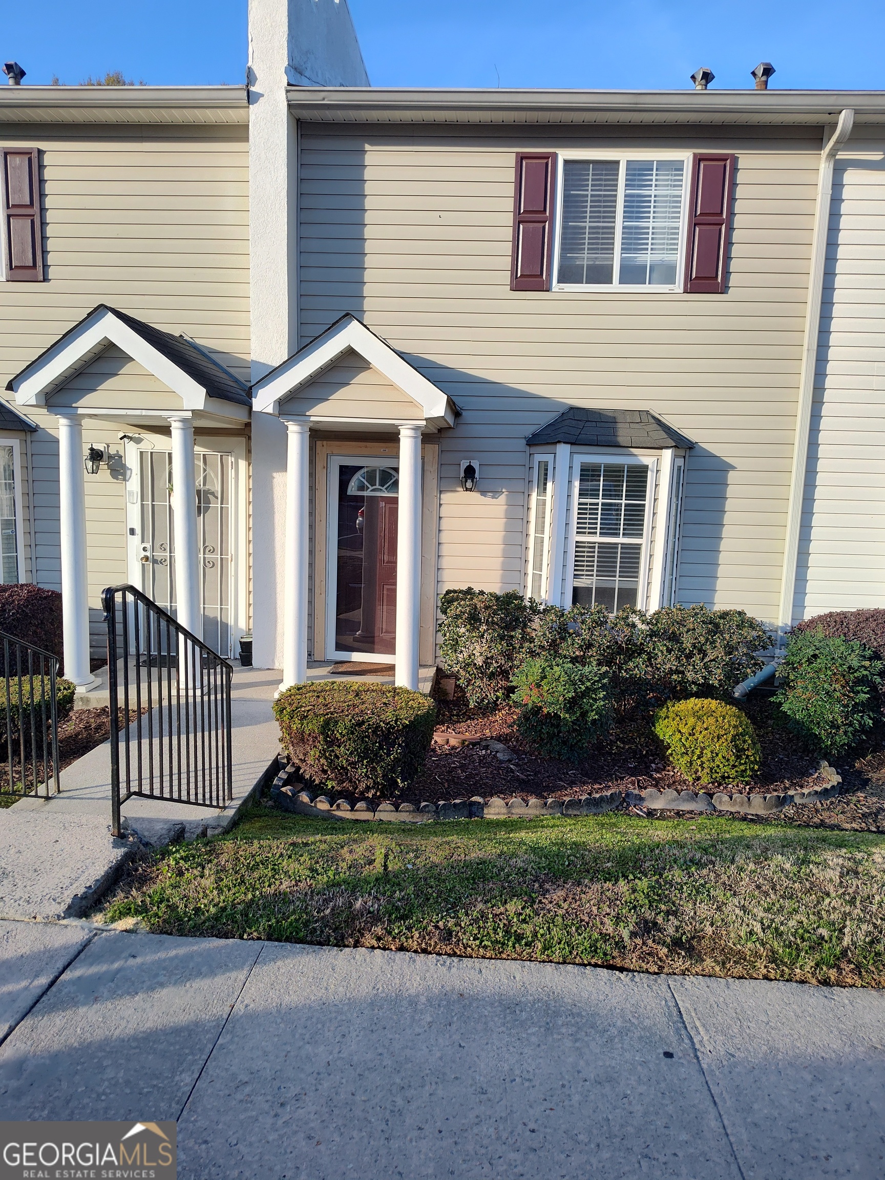 1625 Conley Road, Unit 275 Conley, GA 30288 - Photo 2 of 15 a front view of a house with garden