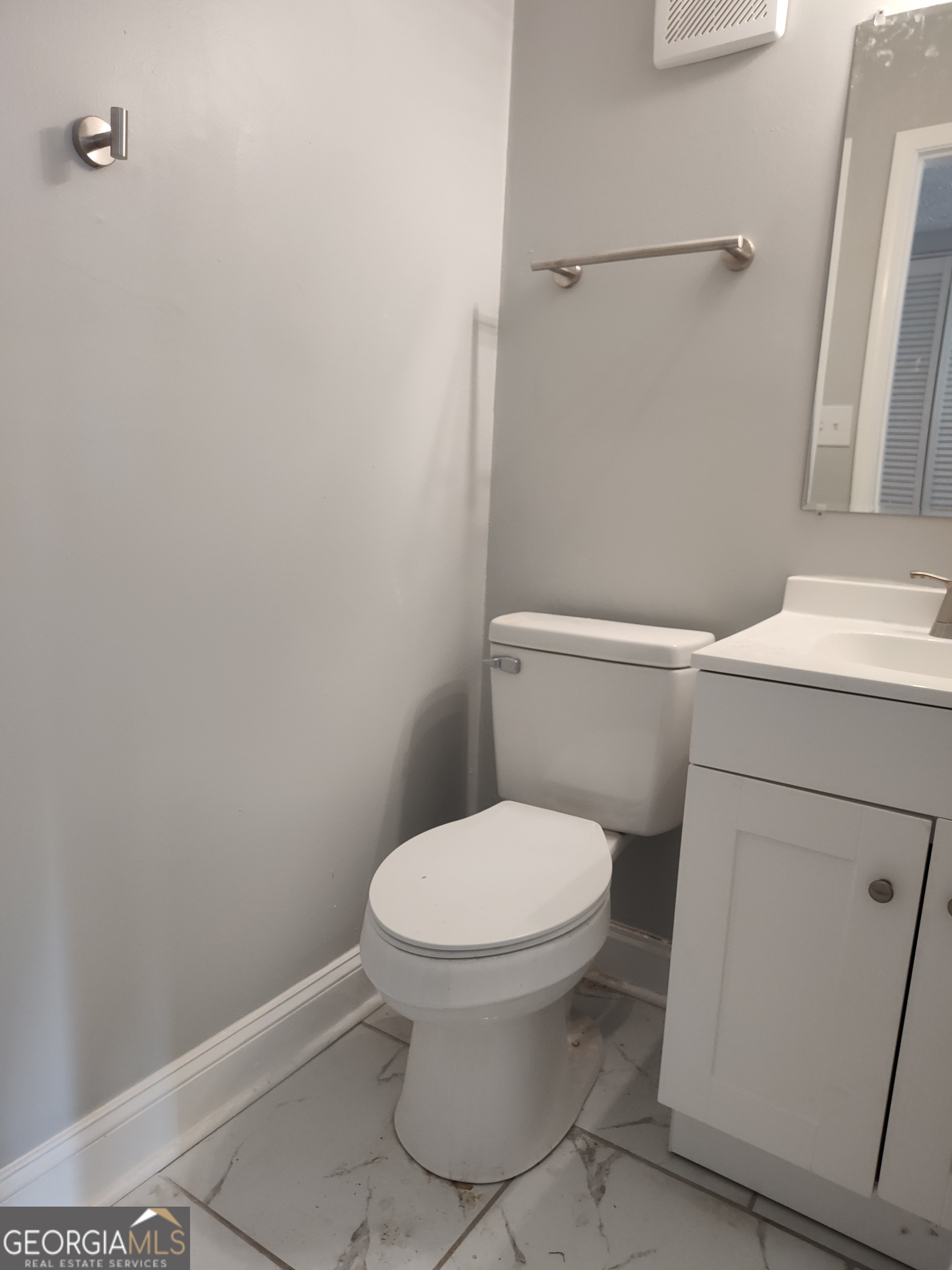 1625 Conley Road, Unit 275 Conley, GA 30288 - Photo 6 of 15 a white toilet sitting next to a bathroom sink