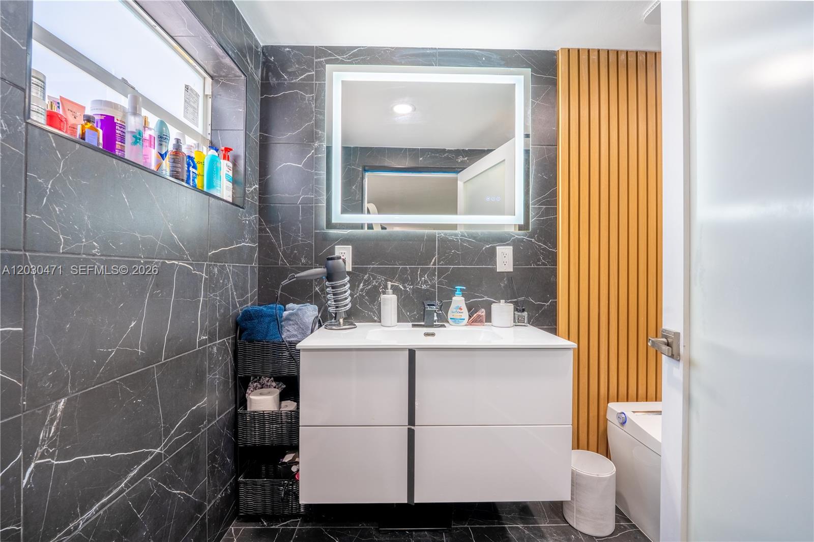 11851 Southwest 181st Street Miami, FL 33177 - Photo 13 of 25 a bathroom with a sink toilet and shower
