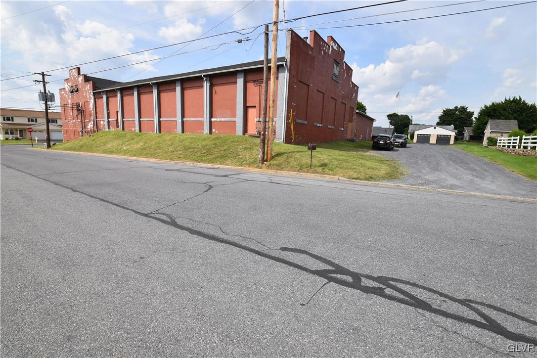a view of a house with a yard and garage