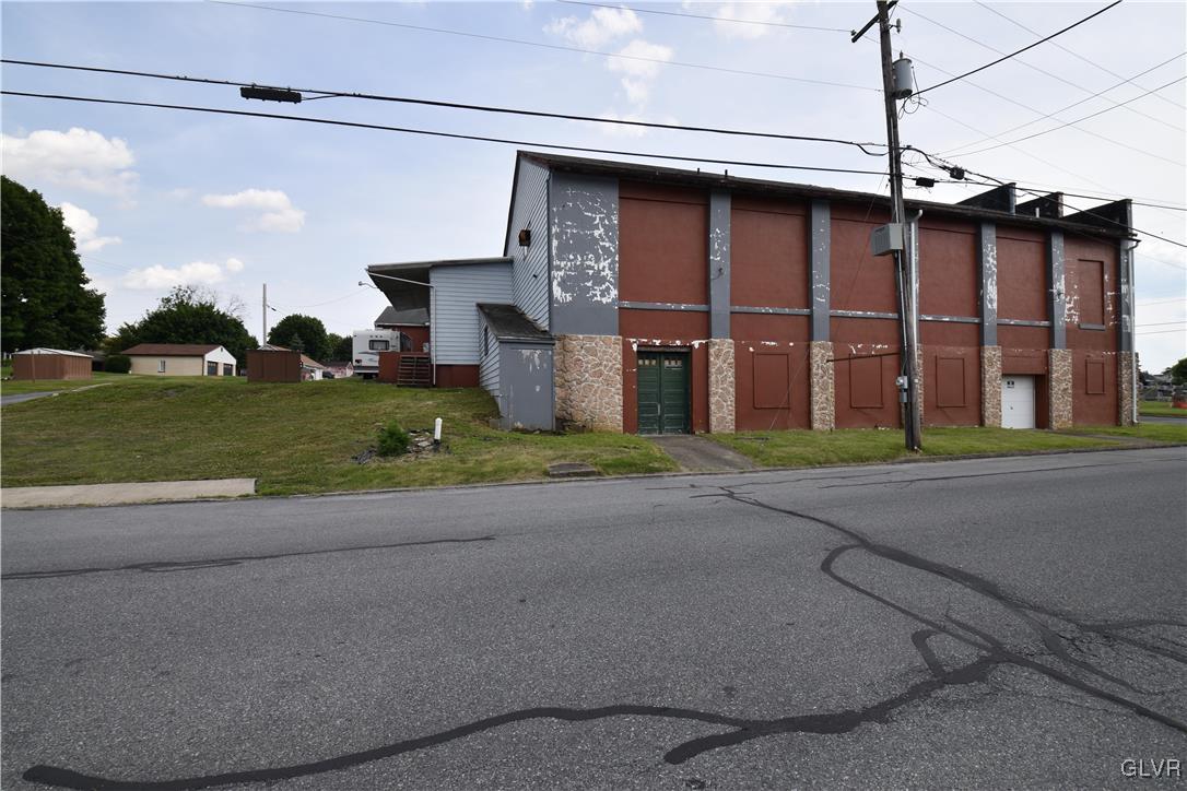 155 North 9th Street Coplay, PA 18037 - Photo 8 of 29 a front view of a house with a yard and garage