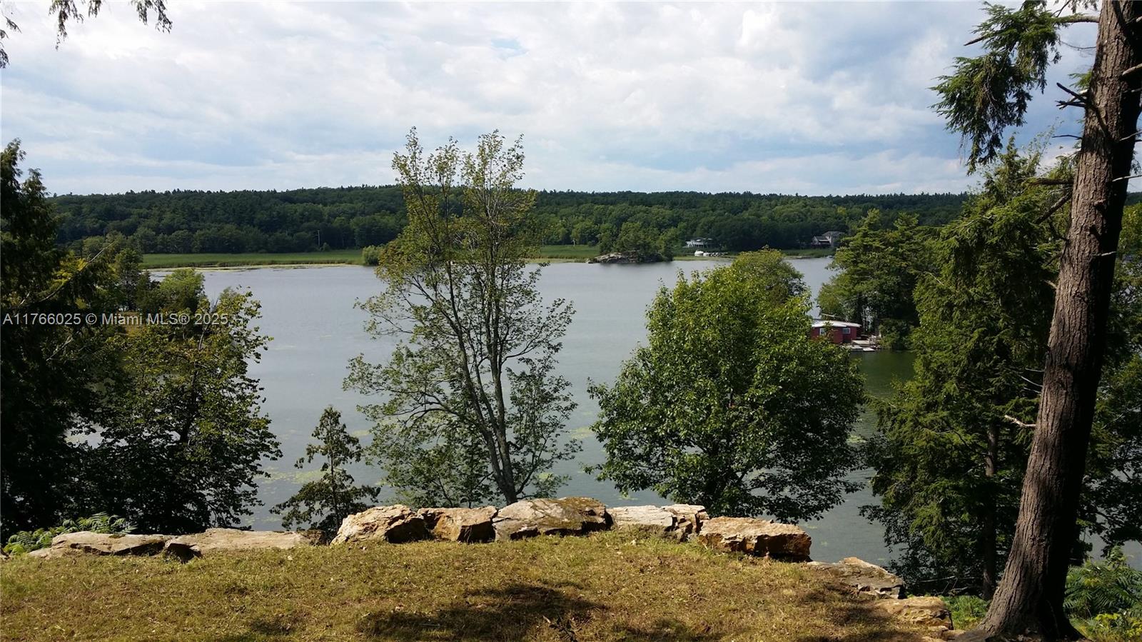 18435 Otter Point Road Wellesley Island, NY 13640 - Photo 17 of 27 a view of a lake with houses