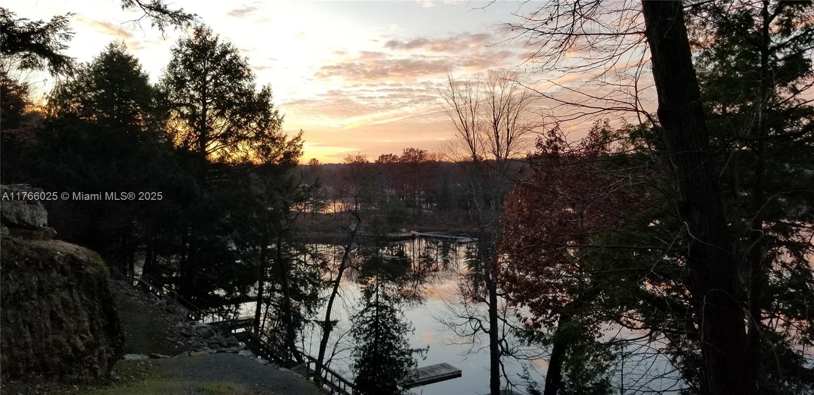 18435 Otter Point Road Wellesley Island, NY 13640 - Photo 2 of 27 a view of mountain view with lots of trees