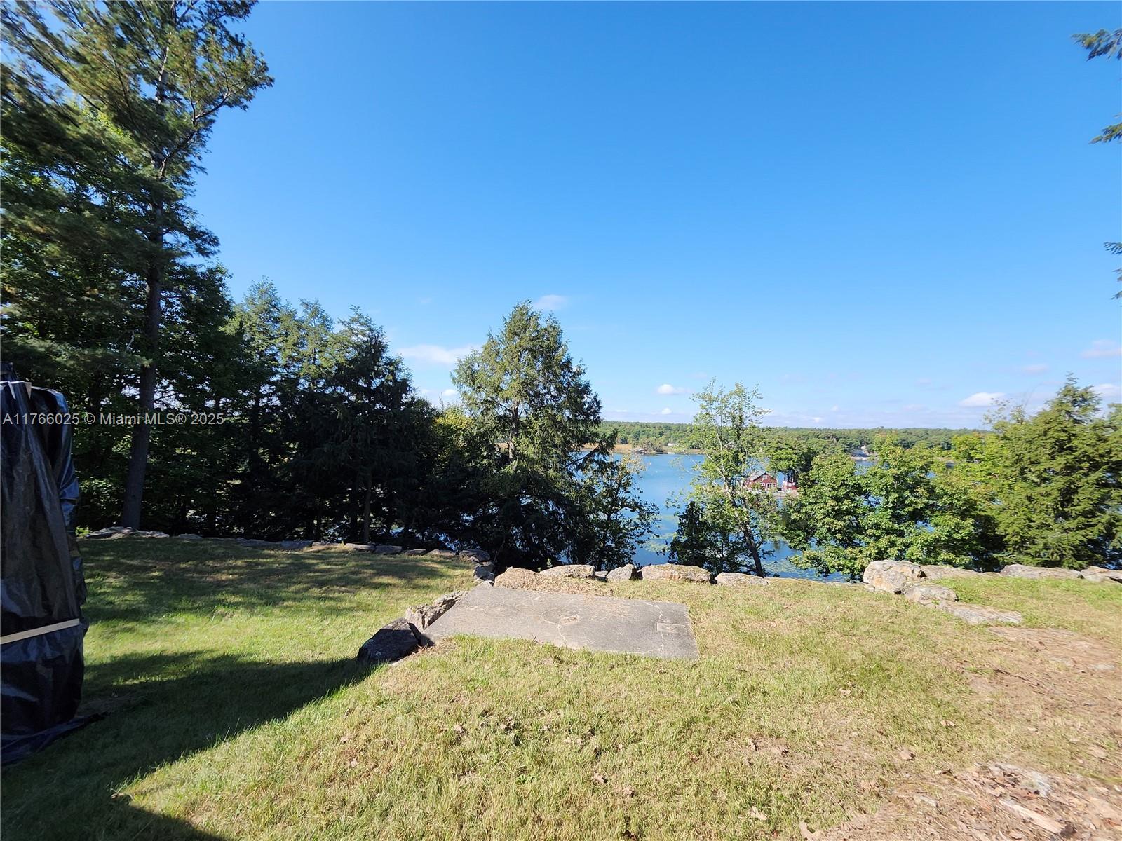 18435 Otter Point Road Wellesley Island, NY 13640 - Photo 25 of 27 a view of swimming pool with a yard
