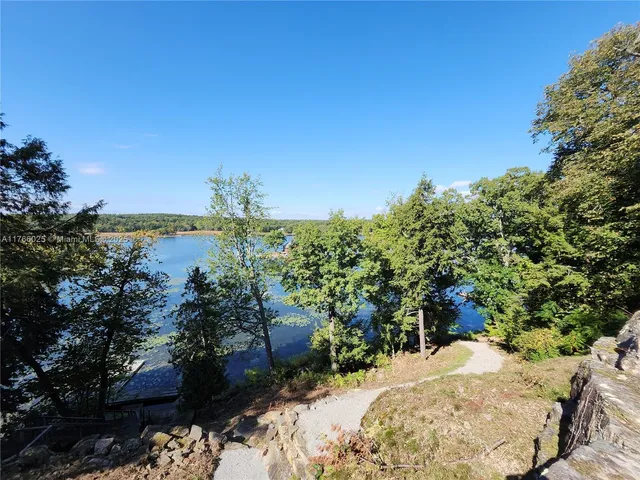 a view of a backyard of the house