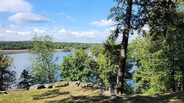 a view of a lake with a house in the background